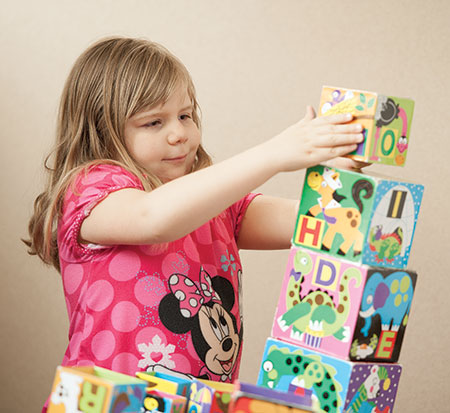 Image of child playing with building blocks