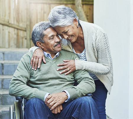 Image of elderly couple embracing