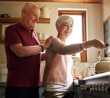 Image of couple working on a project together and smiling